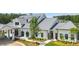 Beautiful clubhouse exterior featuring modern farmhouse architecture, mature trees, and well-manicured lawns at 782 Brooke View Drive, Canton, GA 30115