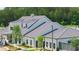 Stunning community clubhouse featuring a modern farmhouse design with ample windows, metal roofing, and lush landscaping at 782 Brooke View Drive, Canton, GA 30115