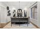 Modern dining room with wainscoting, hardwood floors, and elegant chandelier at 782 Brooke View Drive, Canton, GA 30115