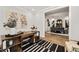Home office leading to dining area featuring decor and black and white striped rug at 782 Brooke View Drive, Canton, GA 30115