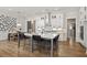 Expansive kitchen with a large island, white cabinets, modern appliances, and an adjacent dining area, perfect for entertaining at 782 Brooke View Drive, Canton, GA 30115