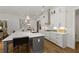 Modern kitchen boasting custom cabinets, a large island with bar seating, and stylish pendant lighting at 782 Brooke View Drive, Canton, GA 30115