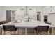 Contemporary kitchen featuring a large island with seating, stainless steel appliances, and modern lighting fixtures at 782 Brooke View Drive, Canton, GA 30115