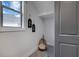 Cozy laundry nook featuring a stylish dog bed and 'wash/dry' decor at 782 Brooke View Drive, Canton, GA 30115