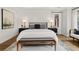 Comfortable main bedroom with shiplap wall detail, stylish furnishings, and cozy decor, creating a warm and inviting space at 782 Brooke View Drive, Canton, GA 30115
