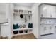 Welcoming mudroom with custom built-in bench, storage, and convenient access to laundry area at 782 Brooke View Drive, Canton, GA 30115