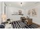 Home office with shiplap wall, desk and chair with modern black and white rug at 782 Brooke View Drive, Canton, GA 30115
