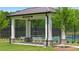 Shade pavilion next to pickleball courts surrounded by lush landscaping at 782 Brooke View Drive, Canton, GA 30115