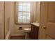 A bathroom featuring a toilet, sink and bathtub at 8469 Shiloh Ct, Jonesboro, GA 30238