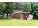 A brick home featuring a screened in porch at 8469 Shiloh Ct, Jonesboro, GA 30238
