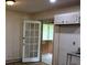 The kitchen features a doorway leading to another room and cabinets on the wall at 8469 Shiloh Ct, Jonesboro, GA 30238