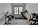 Carpeted room with a treadmill and a keyboard at 1045 Penny Ln, Roswell, GA 30076