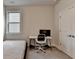 Neutral bedroom featuring a modern desk with computer and minimal decor at 1045 Penny Ln, Roswell, GA 30076
