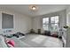 Bonus room featuring two large windows and toys at 1045 Penny Ln, Roswell, GA 30076
