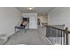 Large bonus room featuring plush carpeting, staircase, and room for recreation and play at 1045 Penny Ln, Roswell, GA 30076