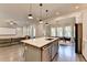 Open concept living space features a kitchen with island seating, a dining area and a living room at 1045 Penny Ln, Roswell, GA 30076