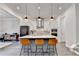 Bright, airy kitchen features island with seating and stainless appliances at 1045 Penny Ln, Roswell, GA 30076