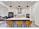 Spacious kitchen features a large island with seating and stainless appliances at 1045 Penny Ln, Roswell, GA 30076