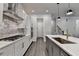 Well-equipped kitchen boasts modern appliances, granite countertops, and sleek cabinetry for a chef-inspired experience at 1045 Penny Ln, Roswell, GA 30076