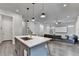 This Kitchen and Living Room offer an open concept and modern feel for entertaining or relaxation at 1045 Penny Ln, Roswell, GA 30076