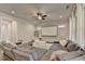 Spacious living area includes a sectional sofa and projector screen, ideal for entertainment at 1045 Penny Ln, Roswell, GA 30076