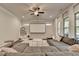 Comfortable living room with a sectional, projector screen, and neutral tones offers a relaxing atmosphere at 1045 Penny Ln, Roswell, GA 30076