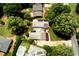 An aerial view of the property surrounded by lush greenery and mature trees at 2737 Fontainebleau Drive, Dunwoody, GA 30360