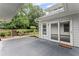 Back patio with access to landscaped backyard and stairs leading to upper yard area, showcasing outdoor living at 2737 Fontainebleau Drive, Dunwoody, GA 30360