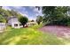 A spacious backyard featuring green grass and mature trees at 2737 Fontainebleau Drive, Dunwoody, GA 30360
