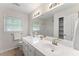 Bathroom featuring double sinks, white cabinets, and a large mirror at 2737 Fontainebleau Drive, Dunwoody, GA 30360