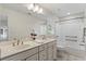Bright bathroom featuring a double vanity and a shower and tub combo at 2737 Fontainebleau Drive, Dunwoody, GA 30360