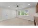 Bright bedroom features a ceiling fan, large windows, and double closets at 2737 Fontainebleau Drive, Dunwoody, GA 30360
