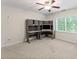 Bedroom with a built-in desk and window at 2737 Fontainebleau Drive, Dunwoody, GA 30360