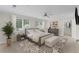 Cozy bedroom with a ceiling fan, two windows, and a decorative rug at 2737 Fontainebleau Drive, Dunwoody, GA 30360