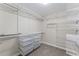 Walk-in closet with shelving and storage bins at 2737 Fontainebleau Drive, Dunwoody, GA 30360