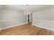 Bright dining room features hardwood floors and elegant chandelier lighting at 2737 Fontainebleau Drive, Dunwoody, GA 30360