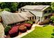 Stunning exterior view of the home with lush landscaping and inviting entrance at 2737 Fontainebleau Drive, Dunwoody, GA 30360