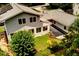 An elevated view of the home's exterior, showcasing well-maintained landscaping at 2737 Fontainebleau Drive, Dunwoody, GA 30360