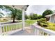 Inviting front porch features white railing and lush landscaping at 2737 Fontainebleau Drive, Dunwoody, GA 30360