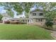 Charming two-story home featuring a lush lawn and beautiful landscaping at 2737 Fontainebleau Drive, Dunwoody, GA 30360