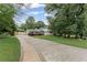 Spacious front yard featuring a long driveway and well-maintained landscaping at 2737 Fontainebleau Drive, Dunwoody, GA 30360