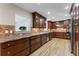 Well-equipped kitchen with wood cabinets, stainless steel appliances, and granite countertops at 2737 Fontainebleau Drive, Dunwoody, GA 30360