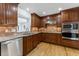 Gourmet kitchen showcasing stainless steel appliances, tile backsplash, and wood cabinetry at 2737 Fontainebleau Drive, Dunwoody, GA 30360