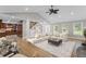Bright living room featuring a large sofa, vaulted ceiling, and hardwood floors at 2737 Fontainebleau Drive, Dunwoody, GA 30360