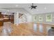 Open-concept living room boasting hardwood floors, staircase and a view to the kitchen at 2737 Fontainebleau Drive, Dunwoody, GA 30360