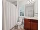 This bathroom features neutral walls, cherry wood vanity, tiled floors and a large mirror at 2873 Overlook Ne Way, Atlanta, GA 30324