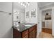 Bathroom with a granite countertop, white sink, wood cabinets, and a walk in closet at 2873 Overlook Ne Way, Atlanta, GA 30324