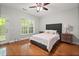 Bedroom with hardwood floors, ceiling fan, and bright natural light at 2873 Overlook Ne Way, Atlanta, GA 30324