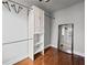 This closet features hardwood floors, built in shelving, closet rod and a full length mirror at 2873 Overlook Ne Way, Atlanta, GA 30324