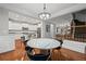 Open concept dining area with marble table connecting kitchen and living area at 2873 Overlook Ne Way, Atlanta, GA 30324